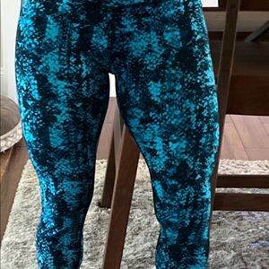 REEBOK stretchy snake print leggings.